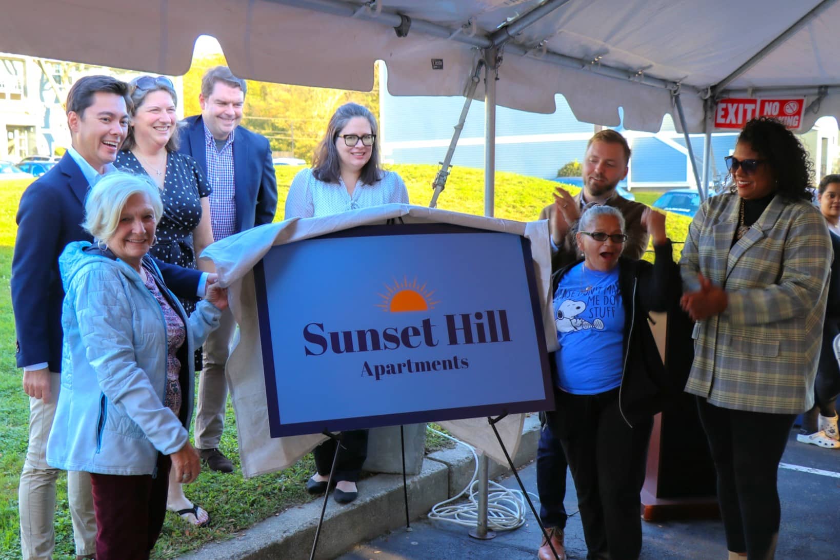 Sunset Hill Sign and people celebrating